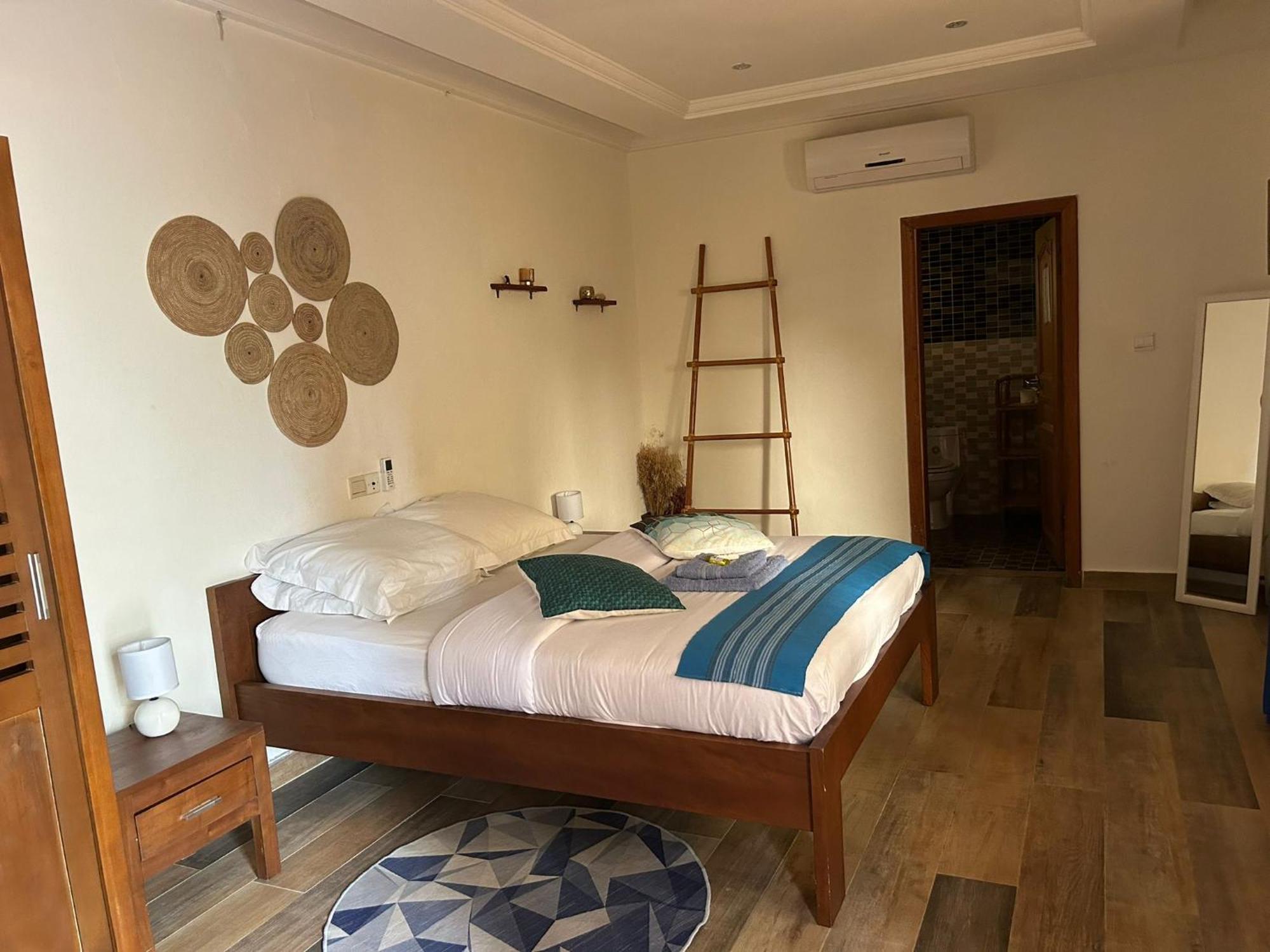 L'Oasis Guesthouse Cotonou Exterior photo